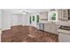Well-lit kitchen featuring stainless appliances, modern countertops, and a view to the deck at 185 Waverly Walk, Douglasville, GA 30134