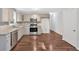 Stylish kitchen with stainless steel appliances, modern gray cabinets, and tiled backsplash at 185 Waverly Walk, Douglasville, GA 30134
