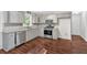 Bright kitchen features stainless steel appliances, modern countertops, and ample cabinet space at 185 Waverly Walk, Douglasville, GA 30134