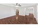 Open living room showcasing hardwood floors, neutral paint, and an open staircase to the next level at 185 Waverly Walk, Douglasville, GA 30134