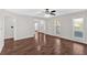 Spacious living room with hardwood floors, recessed lighting, and large windows for plenty of sunlight at 185 Waverly Walk, Douglasville, GA 30134