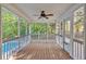 Screened patio with wood floor overlooking a swimming pool and wooded backyard at 185 Waverly Walk, Douglasville, GA 30134