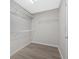 Walk-in closet with wire shelving and modern gray flooring at 185 Waverly Walk, Douglasville, GA 30134