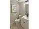 A half bathroom featuring a modern vanity, neutral paint, and stylish fixtures at 191 Northdale Pl, Lawrenceville, GA 30046