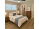 Comfortable bedroom featuring a queen-sized bed, natural lighting, and warm decor at 191 Northdale Pl, Lawrenceville, GA 30046