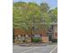 Attractive brick apartment complex with mature trees, manicured shrubbery, and convenient parking, offering a comfortable living space at 191 Northdale Pl, Lawrenceville, GA 30046