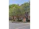 Charming brick apartment complex with mature trees and ample parking, creating a welcoming community atmosphere at 191 Northdale Pl, Lawrenceville, GA 30046