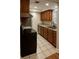 Efficient kitchen boasts wood cabinets, stainless steel appliances, and ample counter space at 191 Northdale Pl, Lawrenceville, GA 30046