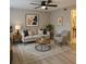 Bright living room featuring stylish decor, a ceiling fan, and modern flooring at 191 Northdale Pl, Lawrenceville, GA 30046