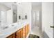 Well-lit bathroom features double sinks, a large mirror, and a separate shower at 758 Beranda Cir, Douglasville, GA 30134