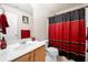 Modern bathroom with a sink, toilet, mirror, and ornate shower curtain at 758 Beranda Cir, Douglasville, GA 30134