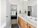 Clean bathroom featuring double sinks, a soaking tub, and access to the main bedroom at 758 Beranda Cir, Douglasville, GA 30134