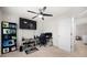 Spacious bedroom with modern ceiling fan, media center, and nearby bathroom at 758 Beranda Cir, Douglasville, GA 30134