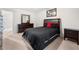 Well-lit bedroom with dark furniture and a king bed at 758 Beranda Cir, Douglasville, GA 30134