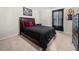 Comfortable bedroom with dark furniture, black bedding, and artwork at 758 Beranda Cir, Douglasville, GA 30134