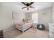 Adorable bedroom featuring a ceiling fan, pink accents, and whimsical decor at 758 Beranda Cir, Douglasville, GA 30134