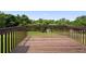 View from wooden deck overlooking a spacious green backyard with mature trees at 758 Beranda Cir, Douglasville, GA 30134