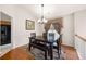 Dining room featuring hardwood floors, a chandelier, a table with seating, and a window at 758 Beranda Cir, Douglasville, GA 30134