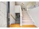 Inviting entryway featuring hardwood floors and staircase leading to the upper level at 758 Beranda Cir, Douglasville, GA 30134