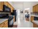 Efficient kitchen with tile backsplash, appliances, and ample counter space, and an adjacent dining area at 758 Beranda Cir, Douglasville, GA 30134