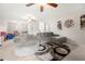 Open-concept living room with multiple ceiling fans and a cozy seating area at 758 Beranda Cir, Douglasville, GA 30134