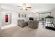 Bright living room with a ceiling fan, comfortable seating, and sliding glass door at 758 Beranda Cir, Douglasville, GA 30134
