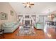 Bright living room featuring hardwood floors, a fireplace, neutral walls, and an open floor plan at 758 Beranda Cir, Douglasville, GA 30134