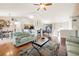 Bright living room featuring hardwood floors, neutral walls, a ceiling fan, and an open floor plan at 758 Beranda Cir, Douglasville, GA 30134