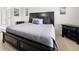 Bright main bedroom features a large bed and matching dark wood furniture at 758 Beranda Cir, Douglasville, GA 30134