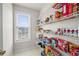 Walk-in pantry has plenty of storage space with wire shelves and a window at 758 Beranda Cir, Douglasville, GA 30134