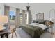 Bright bedroom with a large window, comfortable bed, modern decor, and a view of the city at 775 Juniper St # 212, Atlanta, GA 30308