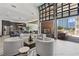Spacious clubhouse with modern decor, comfortable seating, a fireplace, and an open kitchen, ideal for gatherings at 775 Juniper St # 212, Atlanta, GA 30308