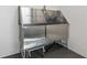 Stainless steel dog bath station with spray nozzle and diamond-patterned tile walls at 775 Juniper St # 212, Atlanta, GA 30308