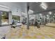 Bright gym featuring modern equipment, a mirrored wall, and access to an outdoor area with a swimming pool at 775 Juniper St # 212, Atlanta, GA 30308