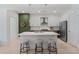 Modern kitchen with stainless steel appliances, a quartz countertop island with seating, and a contemporary design at 775 Juniper St # 212, Atlanta, GA 30308