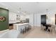 Modern kitchen featuring a quartz island with seating, stainless steel appliances, and a dining area with contemporary decor at 775 Juniper St # 212, Atlanta, GA 30308