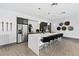 Modern kitchen with stainless steel appliances and breakfast bar at 775 Juniper St # 212, Atlanta, GA 30308