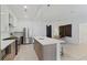 Bright, modern kitchen with stainless steel appliances, a quartz countertop island, and ample cabinet space at 775 Juniper St # 212, Atlanta, GA 30308