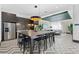 Stylish lounge area with a bar-style table and stainless steel refrigerator situated next to a comfortable sitting area at 775 Juniper St # 212, Atlanta, GA 30308