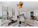 Stylish living room featuring modern decor, an open layout, and a view into the kitchen with a quartz island at 775 Juniper St # 212, Atlanta, GA 30308