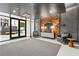 Lobby with a cozy seating area, wood accent wall, stylish decor, and modern lighting at 775 Juniper St # 212, Atlanta, GA 30308