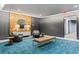 Comfortable lobby area featuring modern seating, a wood-paneled wall, and elegant decor for a welcoming ambiance at 775 Juniper St # 212, Atlanta, GA 30308
