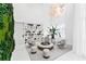 Bright lobby area featuring a cozy seating area with unique light fixtures and a lush green wall at 775 Juniper St # 212, Atlanta, GA 30308