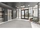 Modern lobby with sleek elevators, a cozy chair, and access to a common area at 775 Juniper St # 212, Atlanta, GA 30308