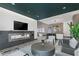 Elegant lounge area featuring a fireplace, mounted TV, comfortable seating, and an open bar area with seating at 775 Juniper St # 212, Atlanta, GA 30308