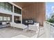 Modern patio featuring sleek white furniture, a contemporary fireplace, and a view of the city skyline at 775 Juniper St # 212, Atlanta, GA 30308
