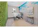 Stylish workspace with unique wall textures, a window, desk, and ample natural light, fostering productivity at 775 Juniper St # 212, Atlanta, GA 30308