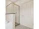 Shower is tiled and has a glass door, complemented by tile flooring at 1199 Lavista Ne Rd, Atlanta, GA 30324