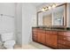 Bright bathroom features a granite countertop vanity and updated fixtures at 1199 Lavista Ne Rd, Atlanta, GA 30324