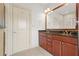 Bathroom features a double vanity with granite countertop, complemented by tile flooring at 1199 Lavista Ne Rd, Atlanta, GA 30324